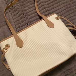 Cute cream colored shoulder tote. Used once.
